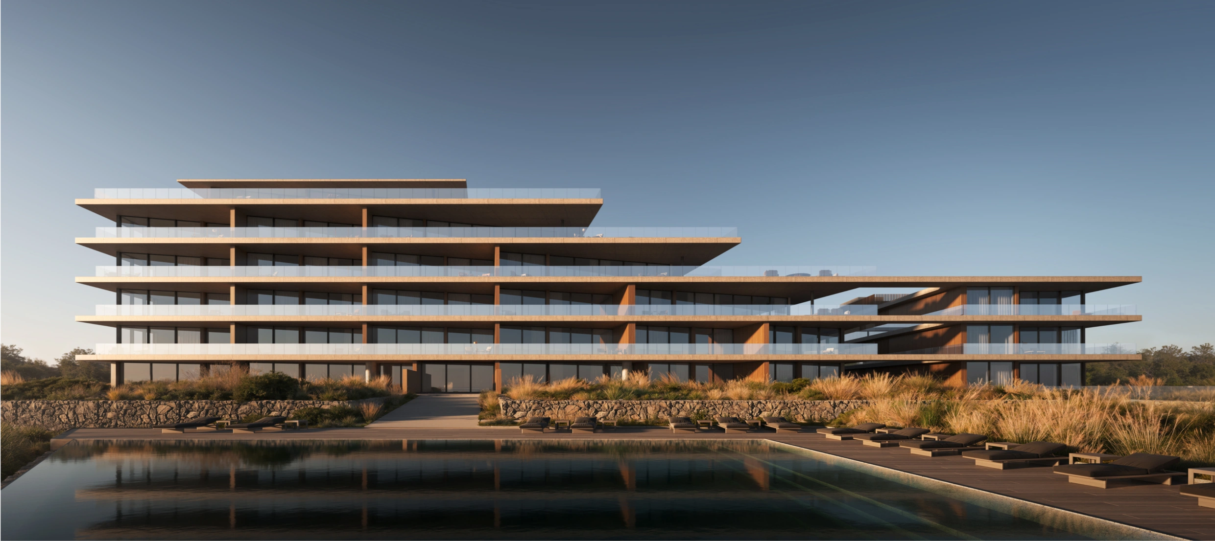 Imagen de un edificio de varios pisos con arquitectura moderna, piscina y terraza, ubicado en un entorno natural.