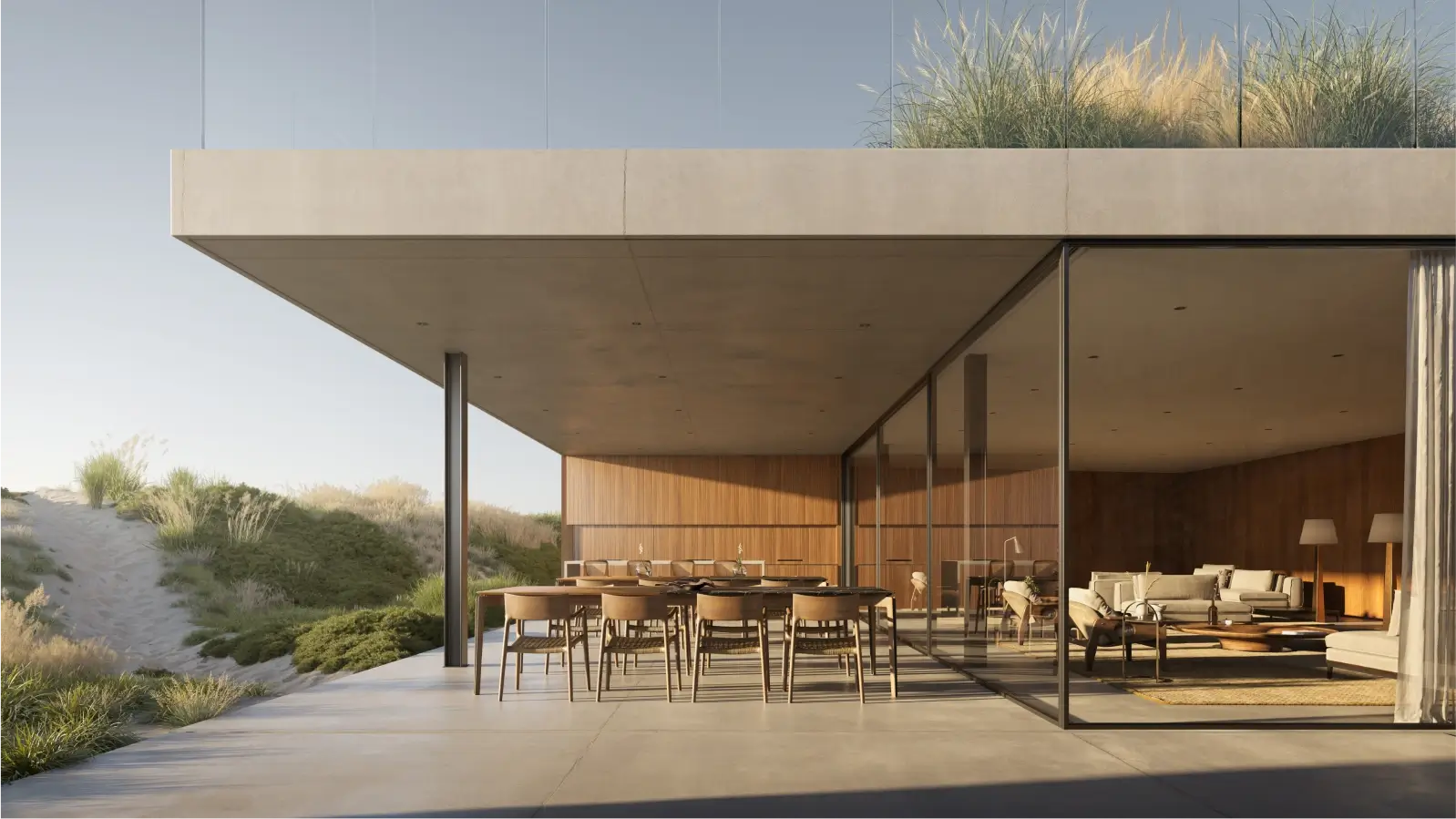 Diseño arquitectónico que fusiona espacios interiores y exteriores, con una terraza que se extiende hacia un jardín y ofrece vistas panorámicas.