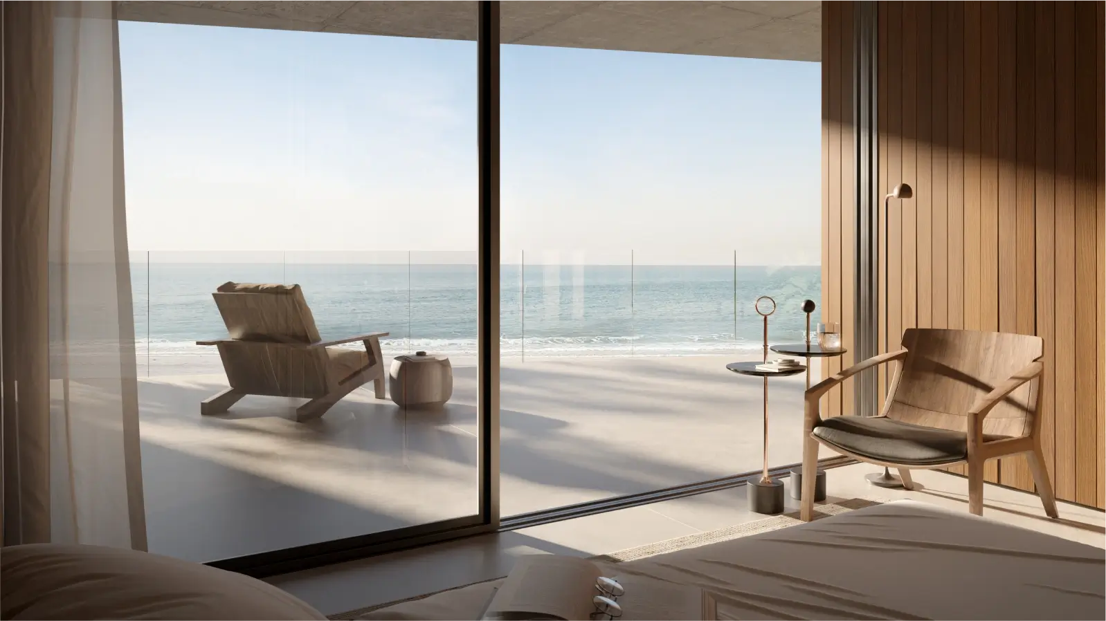 Amplio dormitorio con grandes ventanales que ofrecen vistas panorámicas al océano, perfecto para relajarse y disfrutar de la tranquilidad.